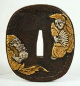 A JAPANESE BRONZE SHAKUDO TSUBA, depicting two amusing figures, the reverse with a gourd shape flask