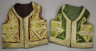 TWO TURKISH EMBROIDERED WAISTCOATS, one with green velvet, the other red velvet, both with gilt