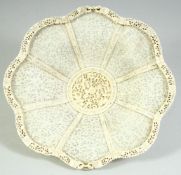 A FINE CHINESE CANTON CARVED AND PIERCED IVORY BASKET, the basket delicately carved with panels of