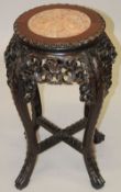 A GOOD CHINESE MARBLE INSET CARVED HARDWOOD STAND, with carved and pierced frieze on four carved