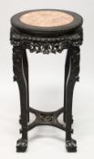 A CHINESE CARVED HARDWOOD AND MARBLE INSET VASE STAND, with pierced and carved frieze depicting