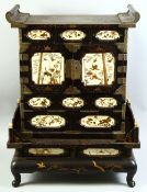A FINE JAPANESE LACQUER, IVORY AND SHIBAYAMA TABLE CABINET ON STAND, comprising two ivory and