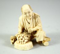 A JAPANESE CARVED IVORY OKIMONO, of a wood cutter, the base inset with red seal tablet, 7cm high.