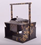 A SUPERB JAPANESE LACQUER SMOKERS CABINET / TABAKO BON, with gilt decoration, the top inset with a