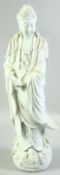 A LARGE DEHUA BLANC DE CHINE PORCELAIN FIGURE OF GUANYIN, stood upon a lotus base with waves and