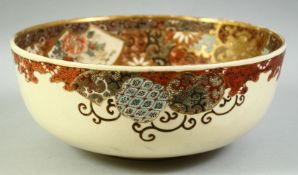 A LARGE JAPANESE SATSUMA BOWL, the interior decorated with figures and further embellished with gilt