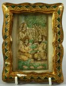 A SMALL 19TH CENTURY FRAMED INDIAN MINIATURE SLITHER, painted with seated figures in a garden and