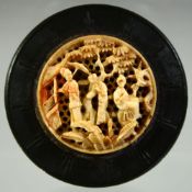 A CHINESE CANTON EBONISED CIRCULAR LIDDED BOX WITH IVORY INSET, the ivory roundel carved and pierced
