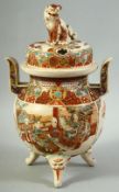 A JAPANESE SATSUMA TWIN HANDLE TRIPOD KORO AND COVER, the cover with moulded with foo dog, the