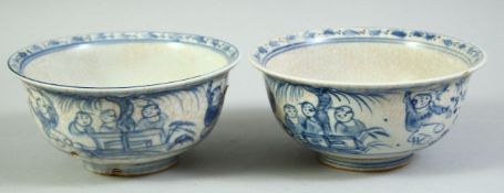 A PAIR OF CHINESE BLUE AND WHITE PORCELAIN BOWLS, each painted with figures, 14cm diameter.