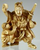 A SMALL JAPANESE CARVED IVORY OKIMONO of a samurai with a monkey, 5cm high.