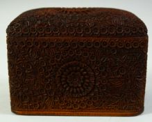 A FINELY CARVED WOODEN CIGARETTE BOX, the hinged lid opening to real a carved monogram with the