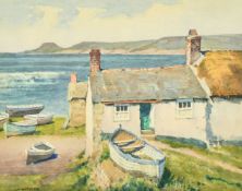 James Marshall Heseldin (1887-1969) British, a view of boats outside a fisherman's cottage,