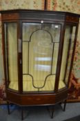 An Edwardian inlaid mahogany standing display cabinet.