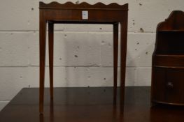 A miniature mahogany silver table.