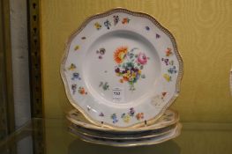 Four Meissen floral decorated plates.