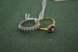 An 18ct white gold and diamond hoop ring together with an 18ct yellow gold, diamond and ruby ring.