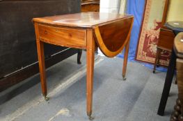 A George III mahogany and satinwood banded oval Pembroke table, with a draw to each end on