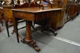 A 19th century mahogany three drawer side table on plain column supports with carved feet.