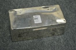 A silver cigarette box.