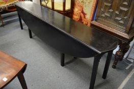 A large ebonised wake table.