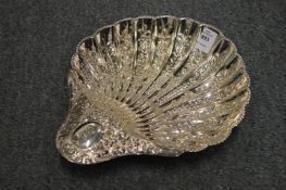 A good embossed silver shell shaped dish with shell scroll feet.