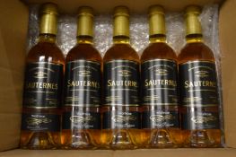 Five half bottles of Waitrose 2009 Sauternes, made at the Chateau Suduiraut.