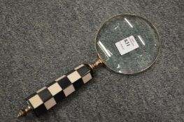 A decorative magnifying glass.