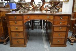 A good 19th century mahogany pedestal desk with leather inset top, concave fronted central frieze