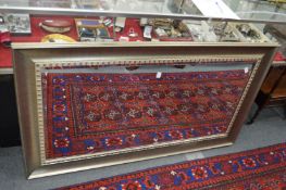 A large rectangular silver framed wall mirror.