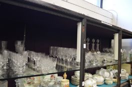 A large shelf of glassware.
