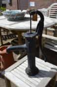 A cast iron garden pump.