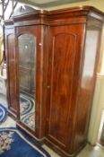 A Victorian mahogany break-front triple wardrobe.