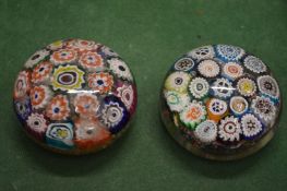 Two glass paperweights.