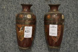 A pair of Japanese cloisonne vases (some damage).