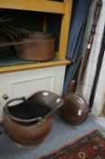 A copper bed warming pan and a coal scuttle.