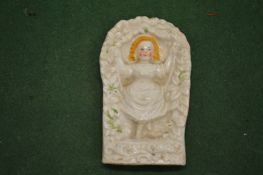 A miniature Staffordshire pottery relief moulded model of a girl on a swing.