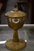 A silver and silver gilt chalice and cover.