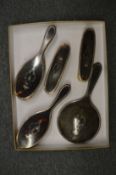 A five piece silver and tortoiseshell dressing table set.