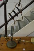 A brass lamp base and a similar item.
