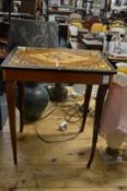 An inlaid musical sewing table.