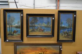 Arab scenes with figures and camels, a set of three, uniformly framed and glazed.