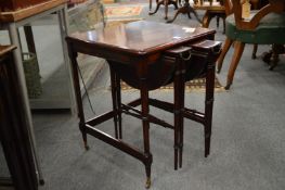 A mahogany nest of tables.