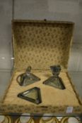 A stylish Art Deco three piece dressing table set, cased (scent bottle stopper chipped).