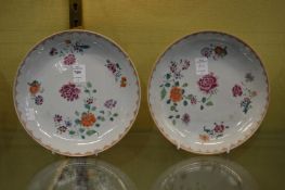 A pair of Chinese Famille Rose plates.
