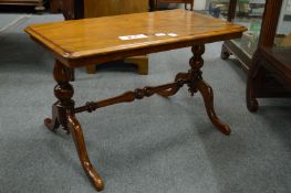 A mahogany rectangular coffee table.