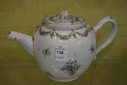 A Chinese black and gilt decorated teapot.