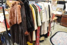 A quantity of ladies' clothing and accessories to include hats.