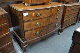 A mahogany bow front chest of drawers on cabriole legs.