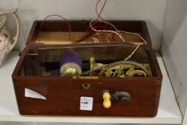 A Victorian mechanical electric shock device in a mahogany case.